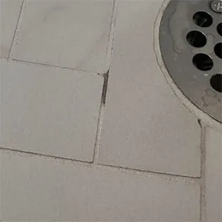 picture of dark grout line in shower