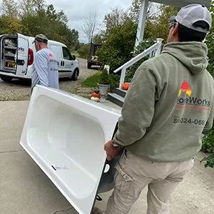 HomeWorks cgo team removing bath tub from home