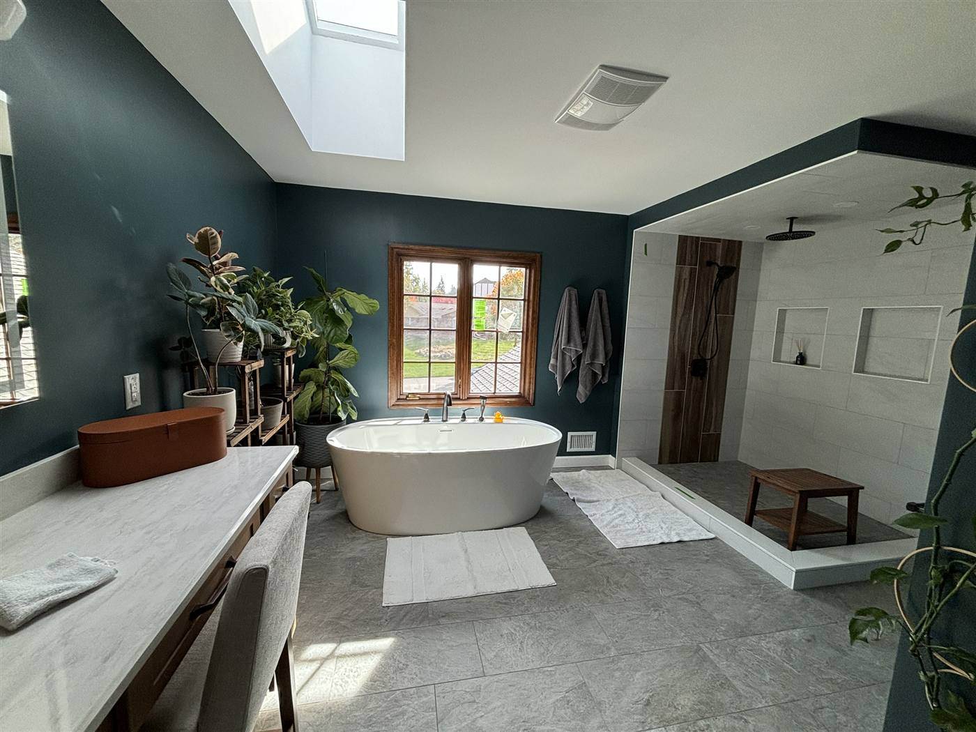 Primary bathroom with a freestanding tub and a walk-in shower