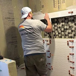 worker remodeling shower