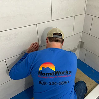 HomeWorks cgo carpenter checking level of kitchen base cabinets