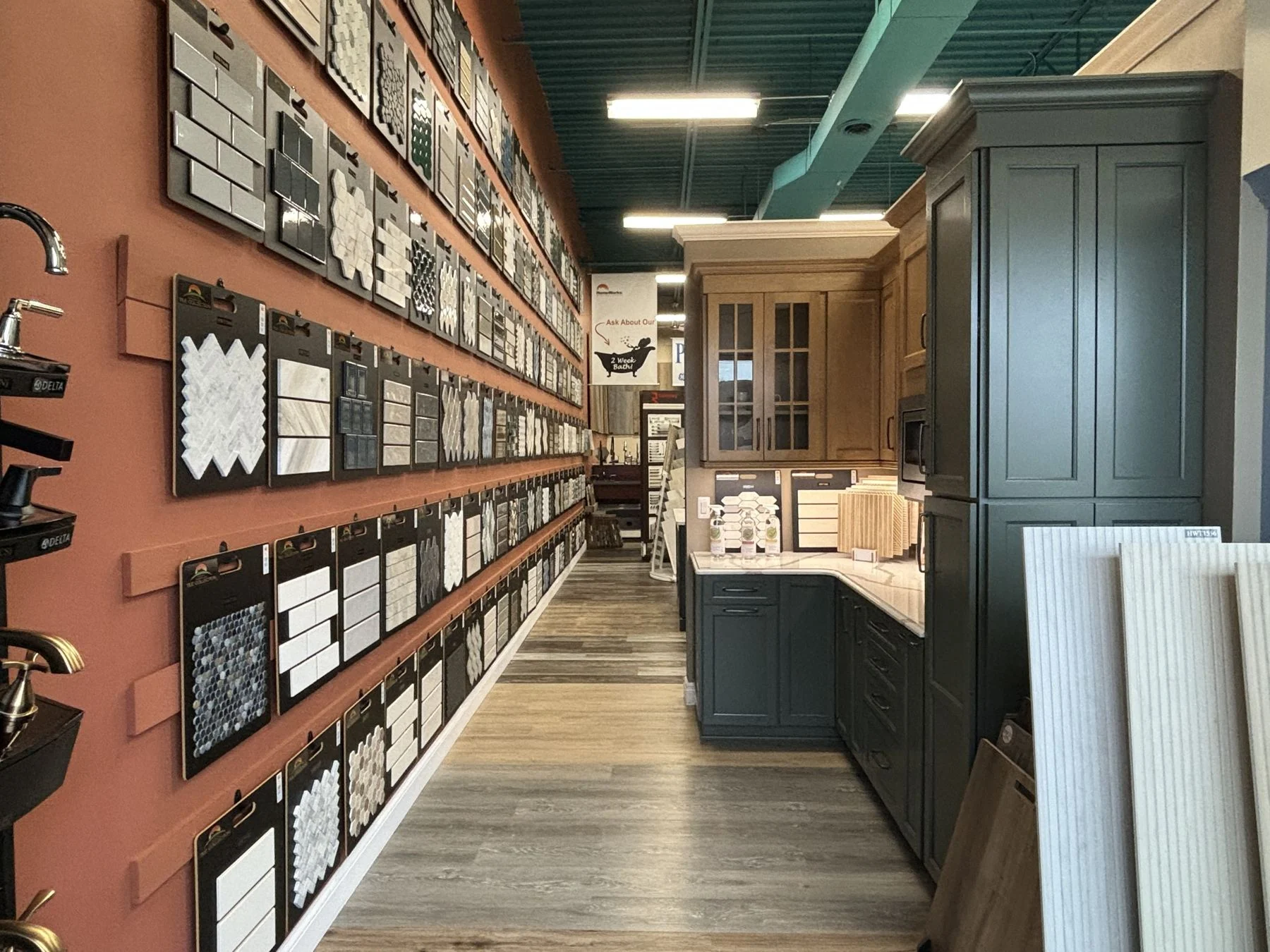 Tile aisle and cabinet displays in the HomeWorks showroom